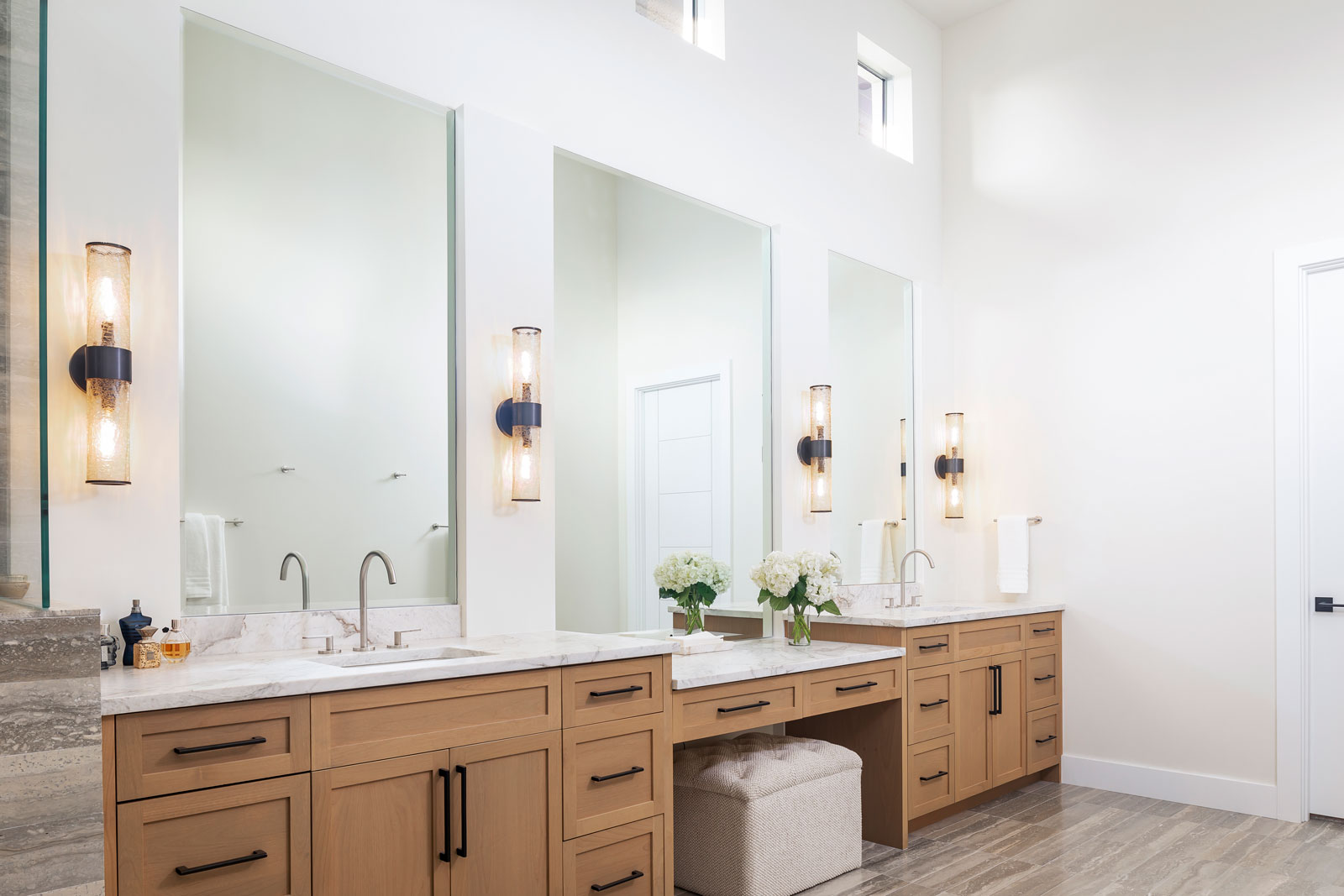 Luxurious master bath with double sinks and sitting area