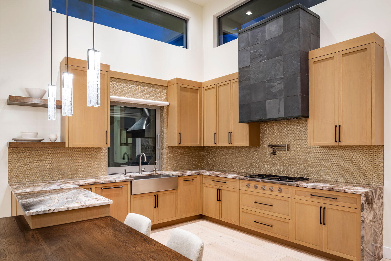 Luxury kitchen with granite counters, custom cabinets, and stainless sink